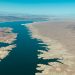 Expansive aerial view showing Lake Mead along the Colorado River with a desert landscape.